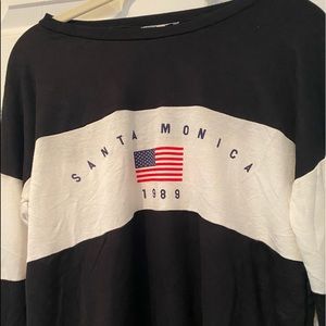 Black and white shirt with “Santa Monica” detail.